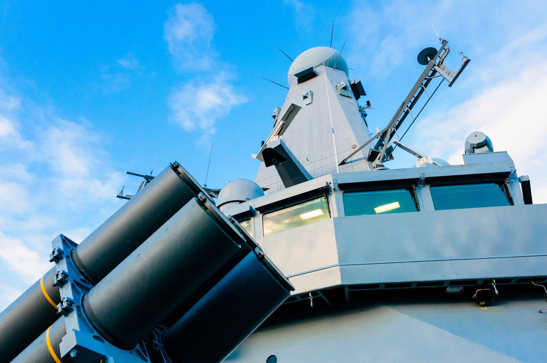 Missile launch tubes in front of the bridge and radar system of a British Royal Navy warship